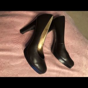 Candie’s brown heels.